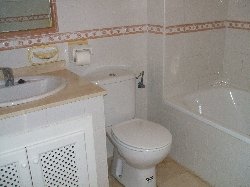 bathroom with bath and shower