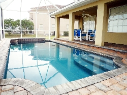 Enjoy a swim in the fully screened pool