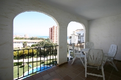 Covered balcony overlooking private pool