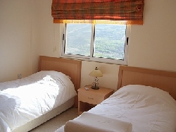 one of the twin bedrooms with wardrobes