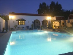 villa and pool at night