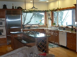Kitchen - gas cooktop in granite island