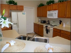 View of fully equipped kitchen