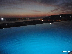 pool at night, overlooking  waterfront