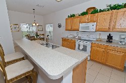 Kitchen area with dining area/stools
