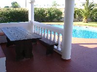 Outside dining area overlooking the pool