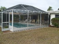 screened pool from rear garden area