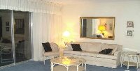sitting room with triple patio doors