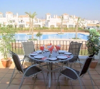 PART OF THE TERRACE OVERLOOKING THE POOL