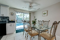 Dining room area with doors to the lanai