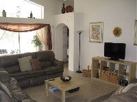 Lounge with patio doors to pool area