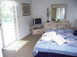 Master bedroom with access to pool area