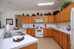 Fully equipped kitchen overlooking pool