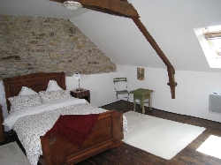 Loft main bedroom with stone walls