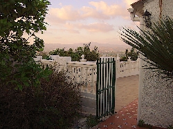 Sun Set  through Gate to Main Villa