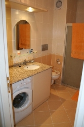 The bathroom with the washing-machine