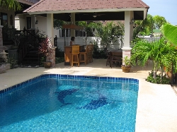 Pool with outside dining and bar area