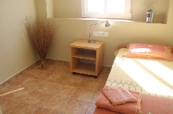 bedroom 3 with stowed bed and sea views