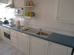 Fully fited kitchen with separate laundr