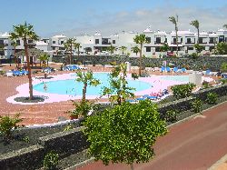 View of pool from upstairs balcony