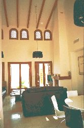 Living /dining area with its high ceilin