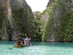 Take a long-tail boat from nearby Rawai