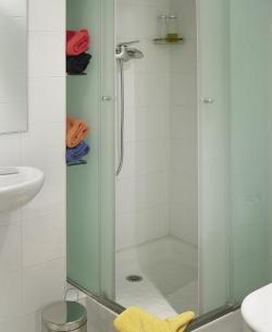 two bathrooms with shower