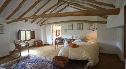 Twin bedroom with beamed ceiling