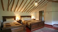 A double/twin bedroom with views up the