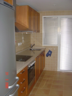 Kitchen area looking into Utility room.