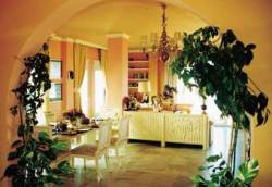 The dining room with its two dining tabl