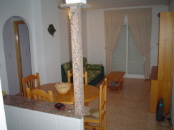 Lounge with patio doors to balcony
