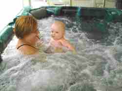 heated hot tub near the pool