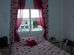 One of the upstairs bedrooms.