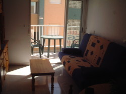 Sofa bed as couch and small balcony