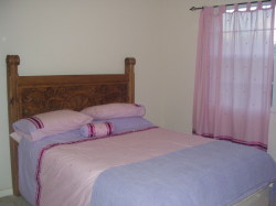 Pretty second bedroom with side sea view