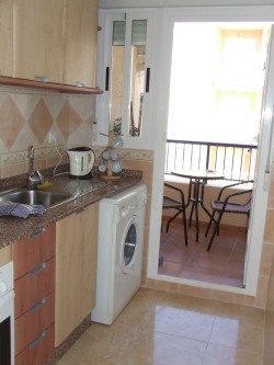 The kitchen leading to the balcony