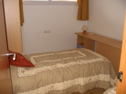 Third bedroom with two single beds and a