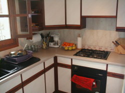 Sunny and fully equipped kitchen.