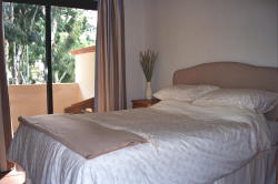 Master bedroom with king sized bed and e