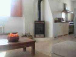logburner and kitchen