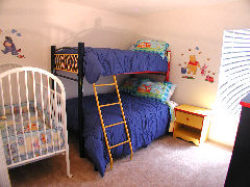 Kids bedroom with bunk and crib