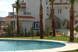 Looking from the pool to the apartment