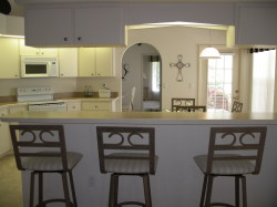 Kitchen opens to pool/screened lanai
