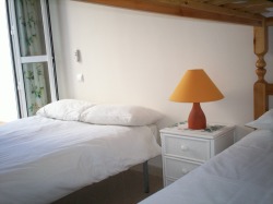 Double bed and bunks in second bedroom