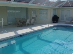 Covered lanai area with patio table