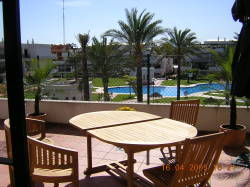 Wooden table set on terrace