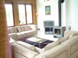 Spacious lounge, seating around log fire
