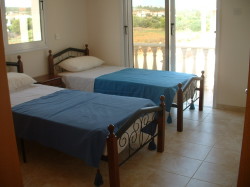 One of bedrooms with single beds