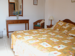 Bedroom 1, twin beds patio doors onto ba